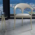 Modern Cream Dining Chair With Gold Frame And Glass Side Table By Large Window With City View