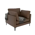 Stylish Modern Brown Leather Single Sofa Chair With Knitted Throw Blanket And Sleek Metal Legs