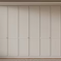 Minimalist White Closet Interior Design With Simple Panel Doors And Wooden Base
