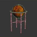 Decorative Orange Red Globe on Silver Metal Stand Featuring Intricate Legs and Smooth Surface