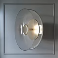 Modern Transparent Lampshade Wall Light With Golden Base On Metallic Wall