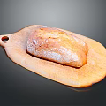 Fresh Crusty Bread Loaf on Wooden Cutting Board Surface