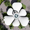 Unique Flower Shaped Building With White Petal Roof And Glass Walls Surrounded By Trees