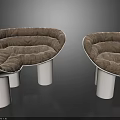 Modern Curved Leisure Chairs With Plush Gray Cushions And White Cylindrical Legs