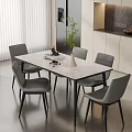 Modern Marble Top Dining Table And Grey Chairs Set With Green Plant And Vase
