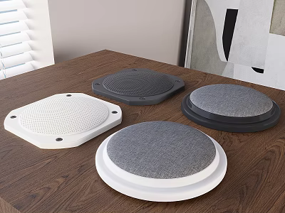 Modern Design Speakers In Various Colors Placed On Wooden Table Top 3d model
