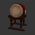 Traditional Red Musical Drum With Decorative Patterns On Leather Drumhead And Wooden Stand