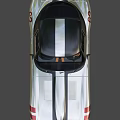 Silver Vintage Sports Car With Black Stripes Sleek Body Round Headlights And Black Roof