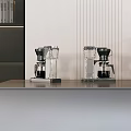 Modern Kitchen Countertop With Two Coffee Machines Gray Surface Vertical Line Decorations And Black Bookshelf
