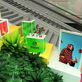 Colorful Display Cubes With Green Plants MAYA Sign And Photo Display In Exhibition