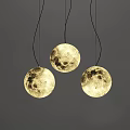 Three Spherical Pendant Lights With Moon Surface Texture Illuminated On Gray Background