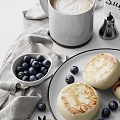 Fresh Blueberries And Toasted English Muffins On White Table With Linen Cloth