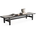 Modern Black Public Bench With Open Magazine Stack Of Books And White Decorative Object