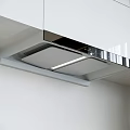 Modern Kitchen Range Hood Appliance With Sleek White Cabinets LED Light And Metallic Trim