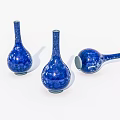 Three Blue Ceramic Vases With White Patterns Slender Neck Round Body One Lying On Side