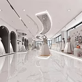Elegant Modern Bridal Shop Interior With White Wedding Dresses And Curved Lighting