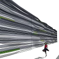 Modern Feature Wall with Layered Striped Design Green Accents and Person Standing Beside
