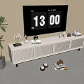 Modern White TV Stand In Living Room With TV Decorations And Green Plants