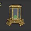 Ornate Golden Lantern Shaped Display Case With Green Orb And Decorative Base