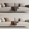 Modern Beige Two-Seater Sofa with Cozy Pillows and Dark Throw Blanket
