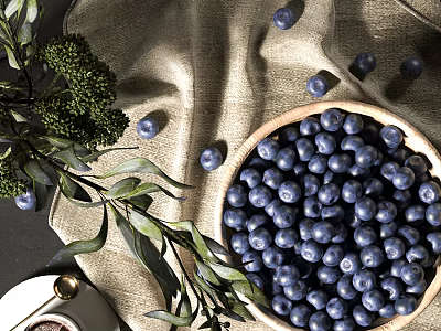 Fresh Blueberries in Wooden Bowl with Scattered Green Leaves and Linen Cloth on Dark Surface 3d model