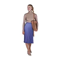A Woman Wearing Beige Top And Purple Pleated Skirt Carrying Brown Bag Against Black Background