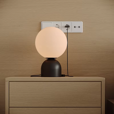 Modern Round Table Lamp With Beige Shade And Black Base On Wooden Nightstand 3d model