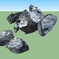 Natural Black Stones With White Snow Covered Surface And Textured Appearance