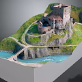Historic Castle on a Rocky Hill with Green Grass Winding Paths River and Bridge