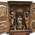 Carved Wooden Religious Altarpiece With Madonna Saints And Painted Triptych Figures