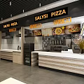 Salysi Pizza Restaurant Modern Interior With Open Kitchen Wooden Counter And Pizza Displays