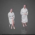 Two Women Wearing White Bathrobes Sitting and Standing on Reflective Floor with Grey Background