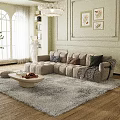 Beige L Shaped Velvet Sofa With Round Coffee Table And Decorative Pillows On Light Carpet
