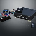 Black Digital Media Player With VHS Tapes Remote Control And Colorful Game Cases Display Setup