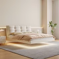 Modern Bedroom Interior With Padded Headboard Beige Bedding Nightstand Lamp And Green Plant