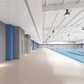 Spacious Indoor Swimming Pool Featuring Clear Blue Water Marked Lanes Ceiling Lights And Blue Walls