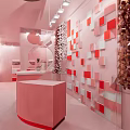 Modern Pink Specialty Store Interior With Geometric Display Counters And Pendant Lights