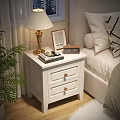 White Double Drawer Nightstand With Golden Handles Gold Lamp Photo Frame And Clock Beside Bed