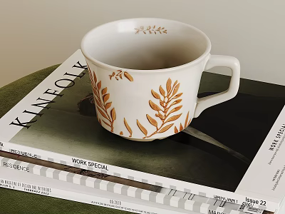 Elegant White Cup With Golden Leaf Designs On KINFOLK Lifestyle Magazine 3d model