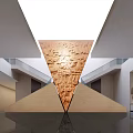 Modern Exhibition Hall Interior With Large Triangular Carved Relief Wall And Glass Railings