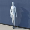 White Human Sculpture Standing Against Blue Wall With Light Colored Floor and Shadow Projection