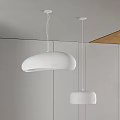 Modern Minimalist Interior With Two White Pendant Lights Hanging From Ceiling