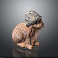 Ceramic Rabbit Figurine Wearing Patterned Hat With Orange White Fish Scale Design And Golden Paws 3d model