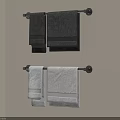 Black and White Towels Hanging on Wall Mounted Towel Racks in Modern Bathroom
