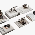 Elegant Stacked Art Magazines With Decorative Sculptures And Figurine Displays