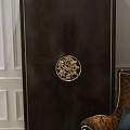 Classic Dark Wood Wardrobe Design With Intricate Golden Carved Handle And Elegant Frame Detailing
