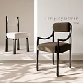 Modern Minimalist Dining Chairs With White And Brown Cushions And Black Frames