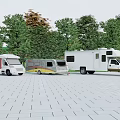 Three RVs and Pickup Truck Parked in Outdoor Area with Green Trees