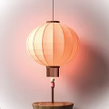 Traditional Yellow Paper Lantern With Striped Design And Hanging Decorative Beads
