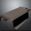 Comfortable Massage Table With Wooden Frame And Striped Blanket And White Pillow